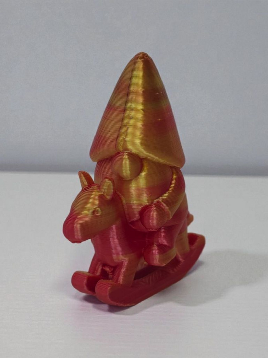 Gnome on rocking horse