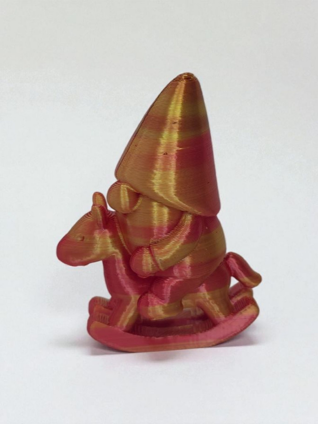 Gnome on rocking horse