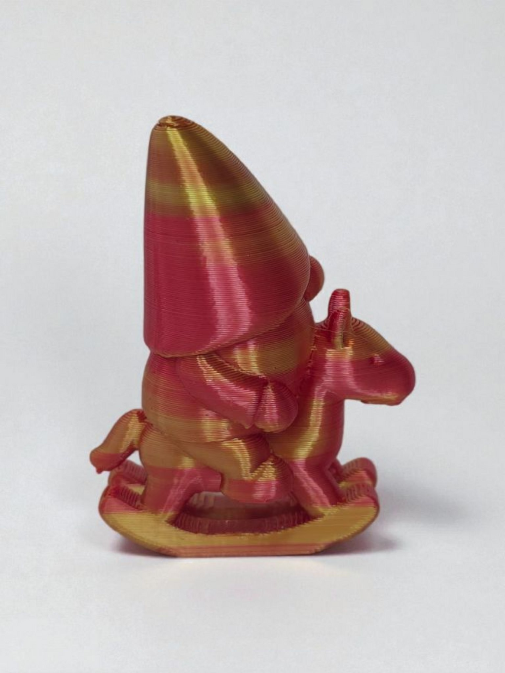Gnome on rocking horse